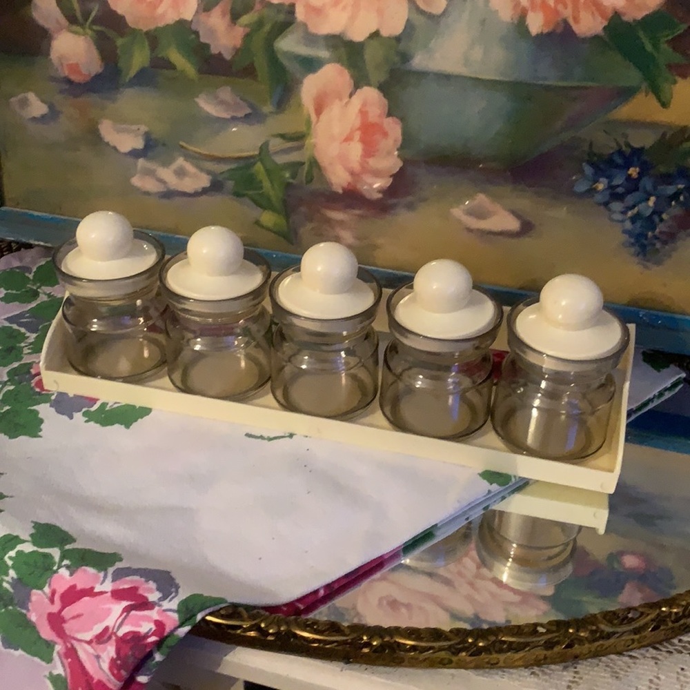 Vintage plastic storage jars with holder. Beige color 12 l x 4 in tall 3 1/2